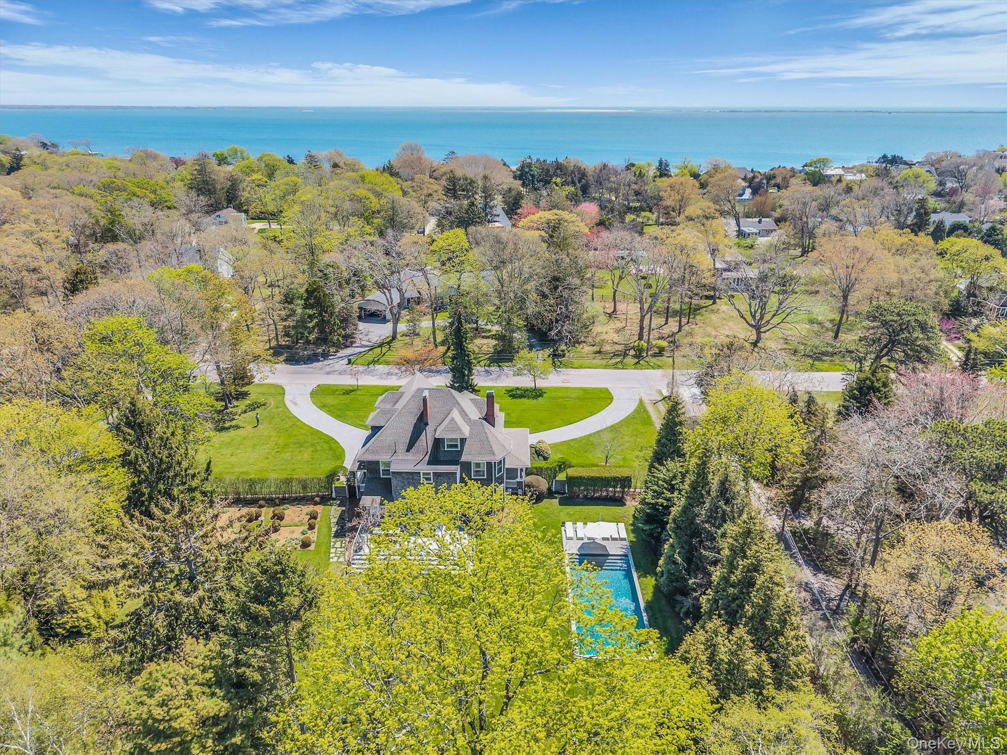 64 South Howells Point Road Bellport, NY 11713 - Photo 42 of 42 a view of a swimming pool with a yard