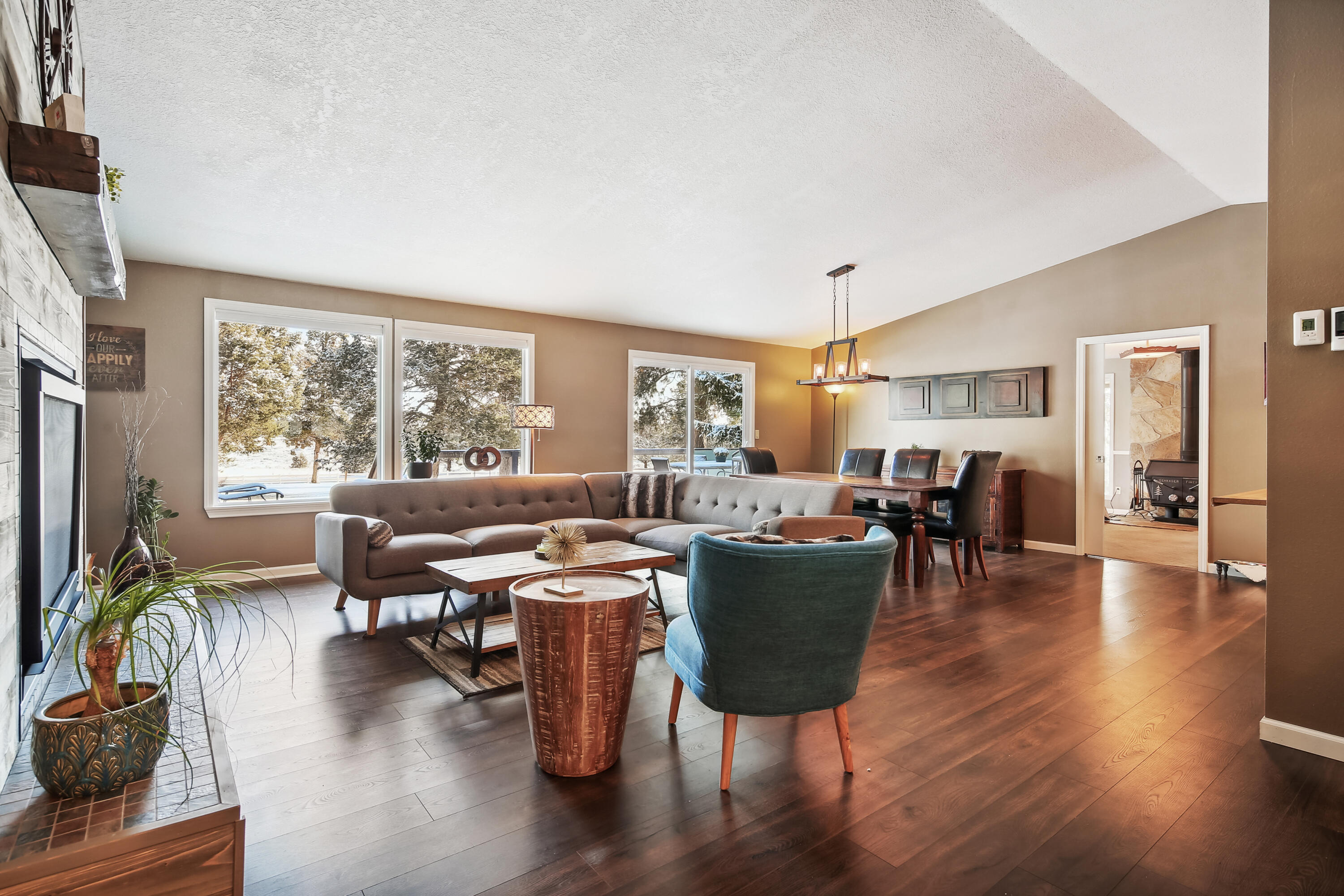 20466 Mainline Road Bend, OR 97702 - Photo 6 of 35 a view of a dining room with furniture window and wooden floor