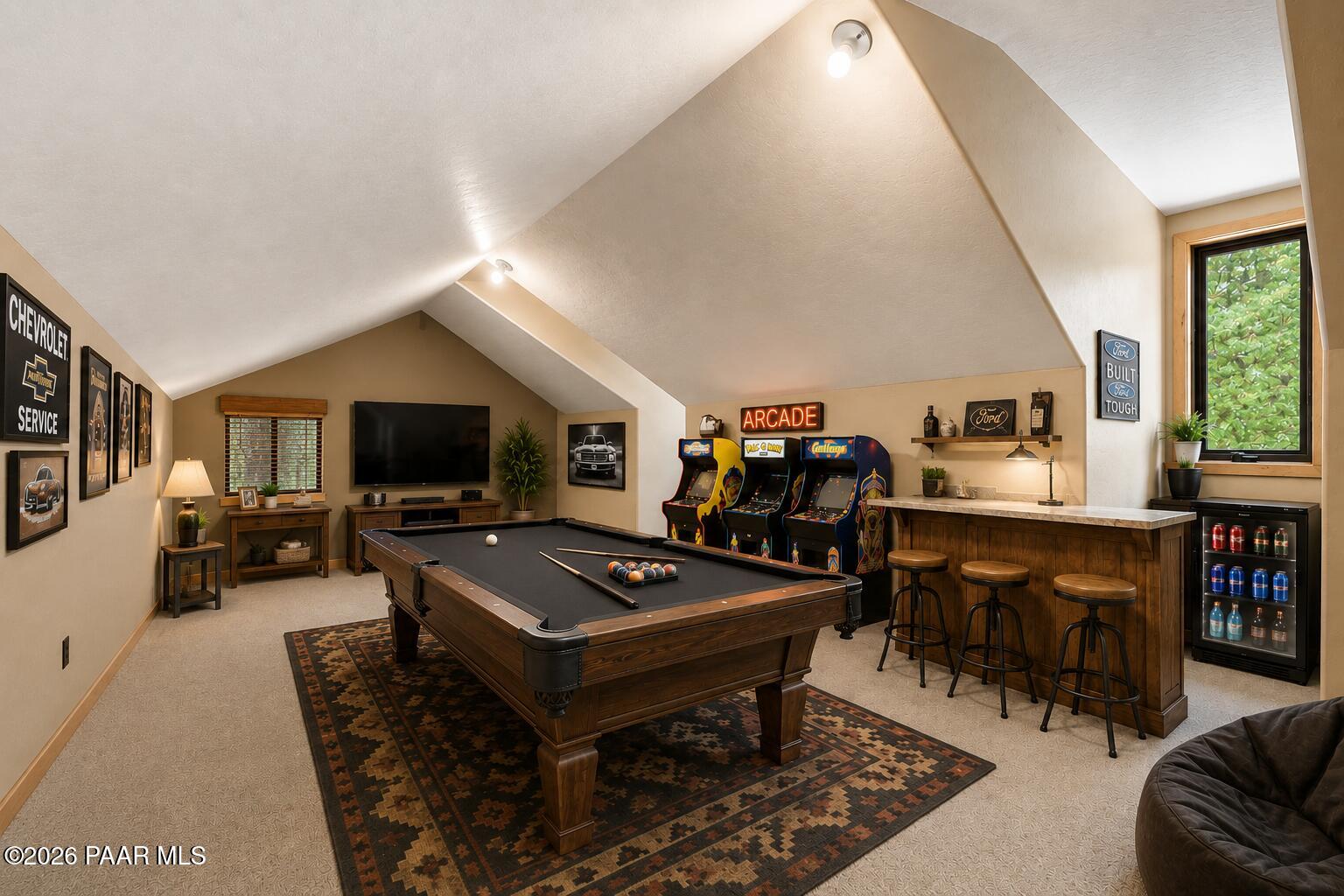 5140 East Charcoal Kiln Road Prescott, AZ 86303 - Photo 116 of 140 a living room with furniture a flat screen tv and a table