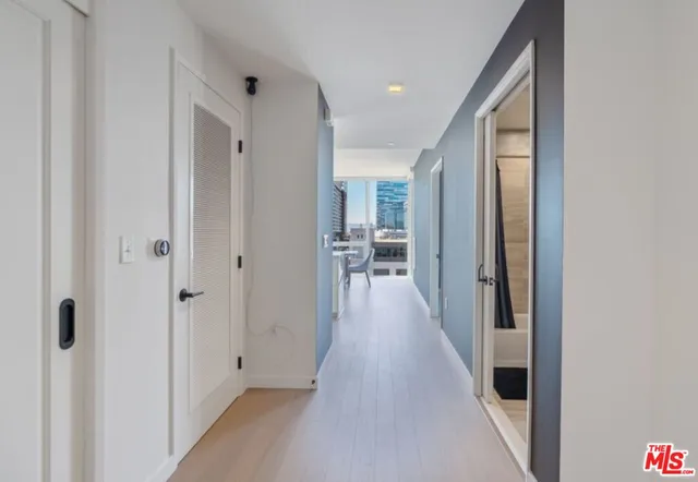 a view of a hallway with a wooden floor