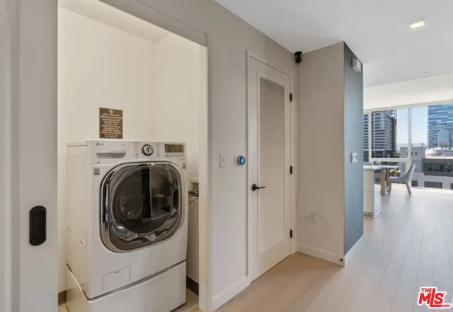 a view of a hallway with washer and dryer