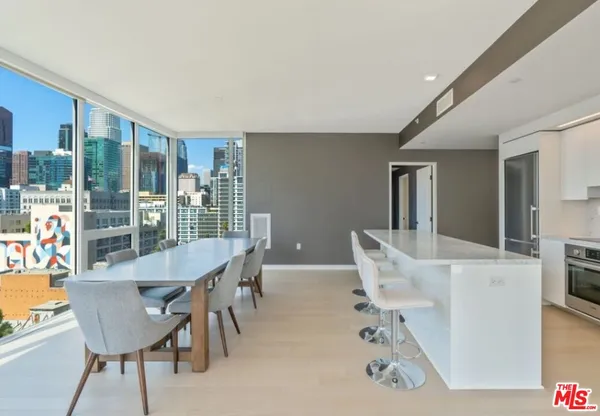 a view of a dining room with furniture window and outside view