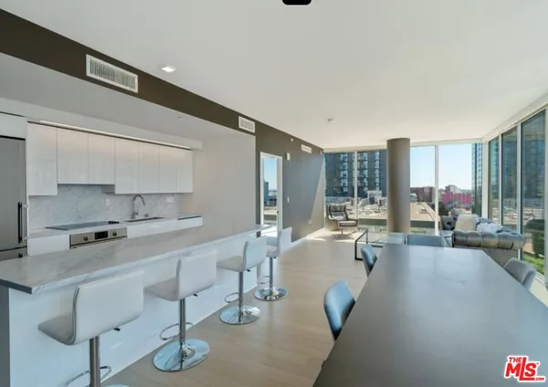 a room with furniture and a view of living room