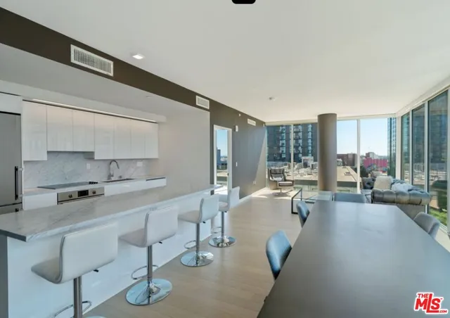 a room with furniture and a view of living room