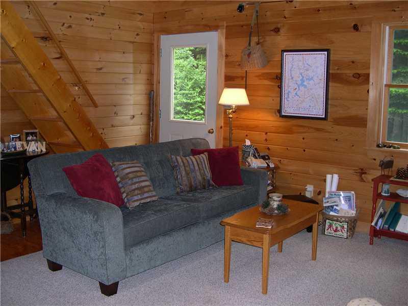 411 Birches Beach Road Oquossoc, ME 04964 - Photo 21 of 24 Living Room. Side entry, stairs to loft