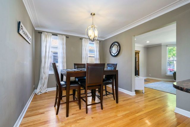 175 Ridgewood Road Riverside, IL 60546 - Photo 4 of 25 a view of a dining room with furniture window and wooden floor