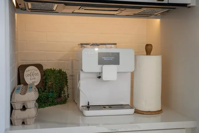 a bathroom with a double vanity sink a mirror and a shower