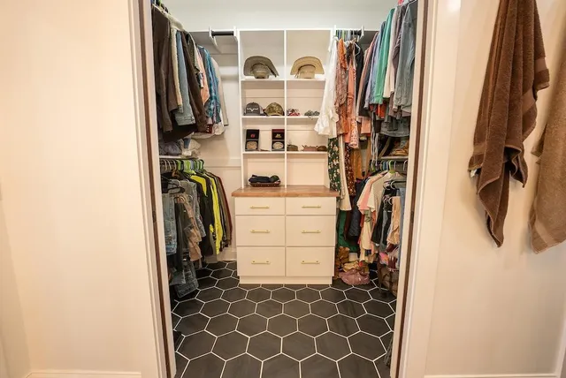 a bedroom with furniture and a window