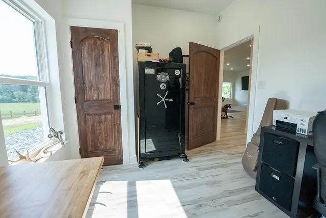 a view of a backyard with seating area and trees around