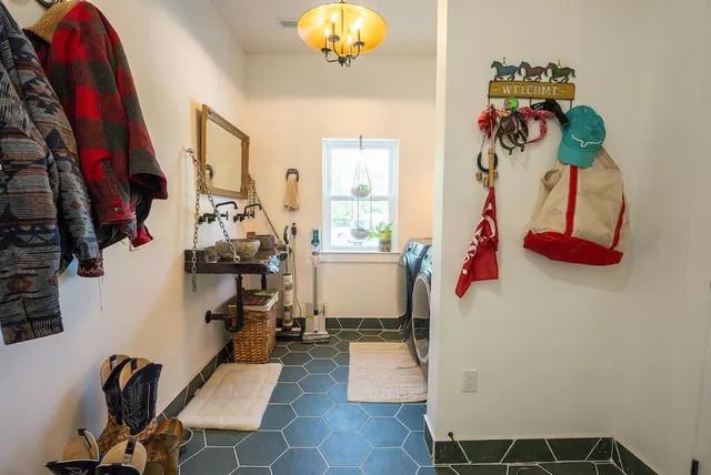 a view of a living room and balcony with garden view