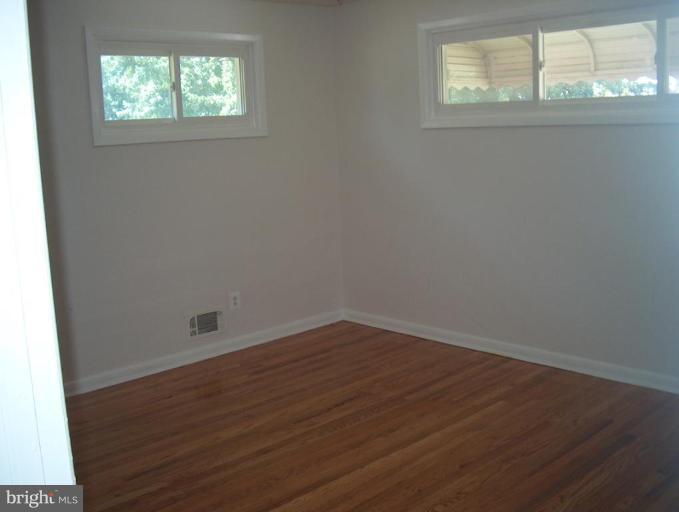 8430 Avery Road Rosedale, MD 21237 - Photo 8 of 10 an empty room with a window