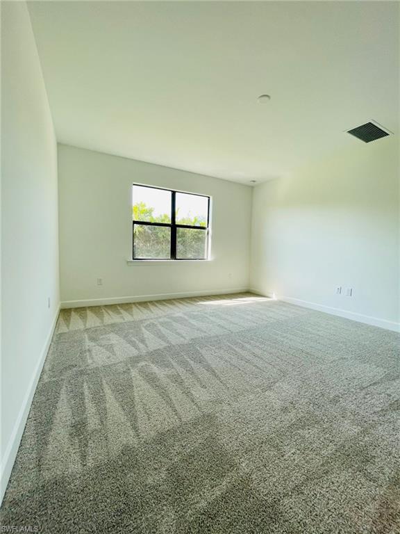 1962 Tripletail Lane Naples, FL 34114 - Photo 14 of 39 an empty room with windows