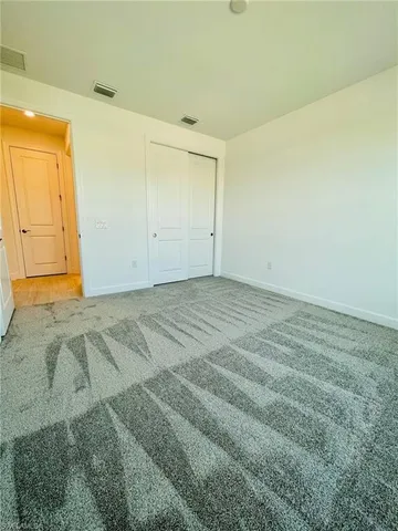 an empty room with a wooden door