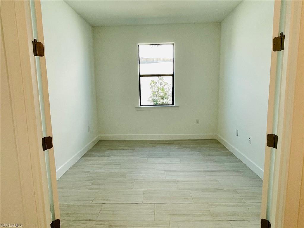 1962 Tripletail Lane Naples, FL 34114 - Photo 23 of 39 a view of a window in an empty room