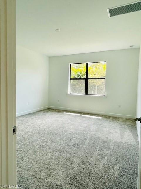 1962 Tripletail Lane Naples, FL 34114 - Photo 24 of 39 an empty room with windows