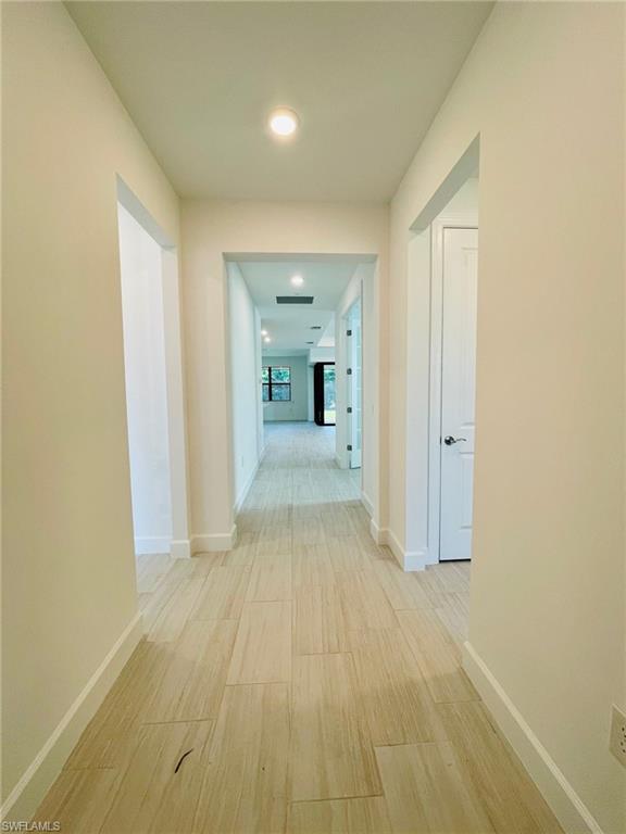 1962 Tripletail Lane Naples, FL 34114 - Photo 3 of 39 a view of a livingroom with a chandelier