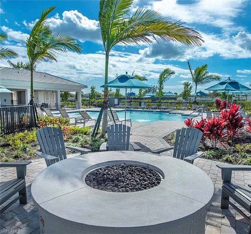 1962 Tripletail Lane Naples, FL 34114 - Photo 36 of 39 a view of a chairs and table in the patio