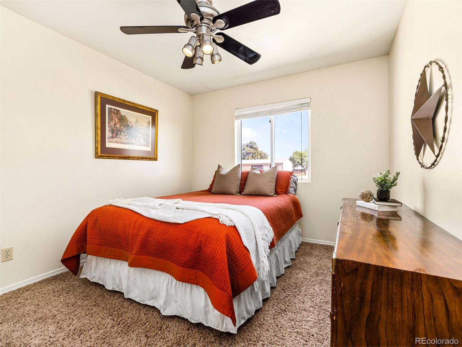 919 South Main Street Fowler, CO 81039 - Photo 11 of 36 a bedroom with bed and wooden floor