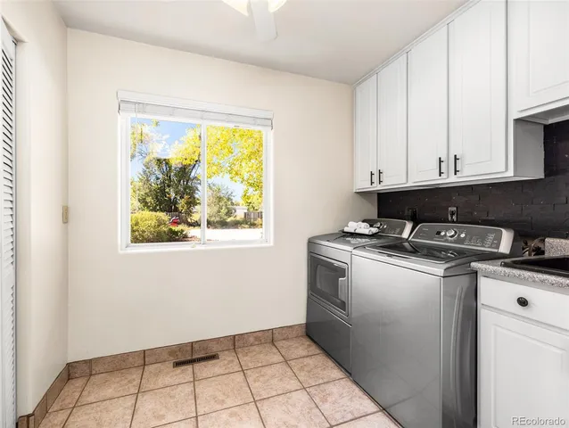 a view of kitchen with stove top oven and cabinets