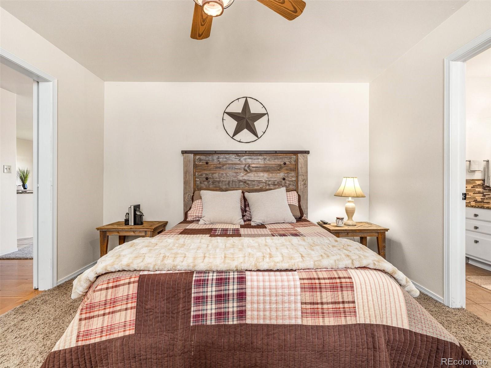 919 South Main Street Fowler, CO 81039 - Photo 19 of 36 a bedroom with a bed and painting on the wall