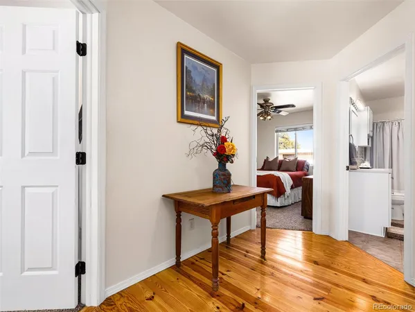 a view of a livingroom with furniture and wooden floor