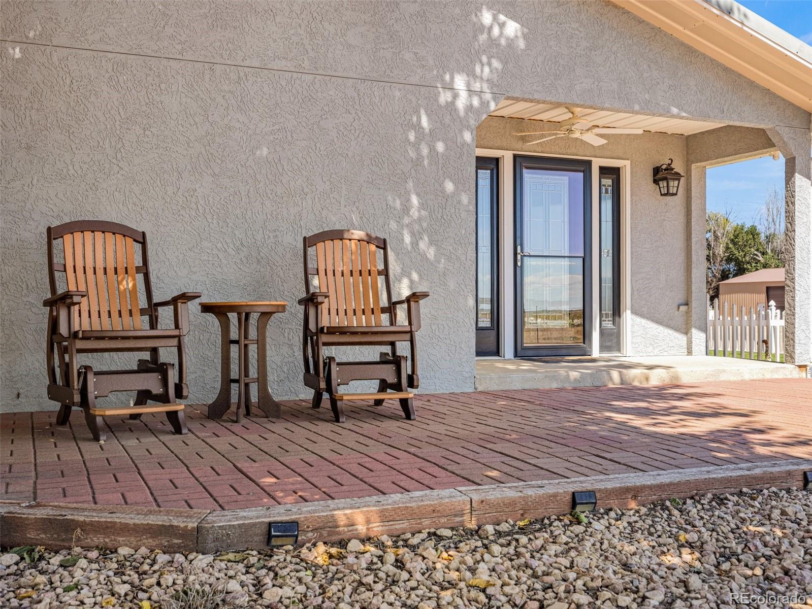 919 South Main Street Fowler, CO 81039 - Photo 24 of 36 a view of a balcony with chairs and wooden floor