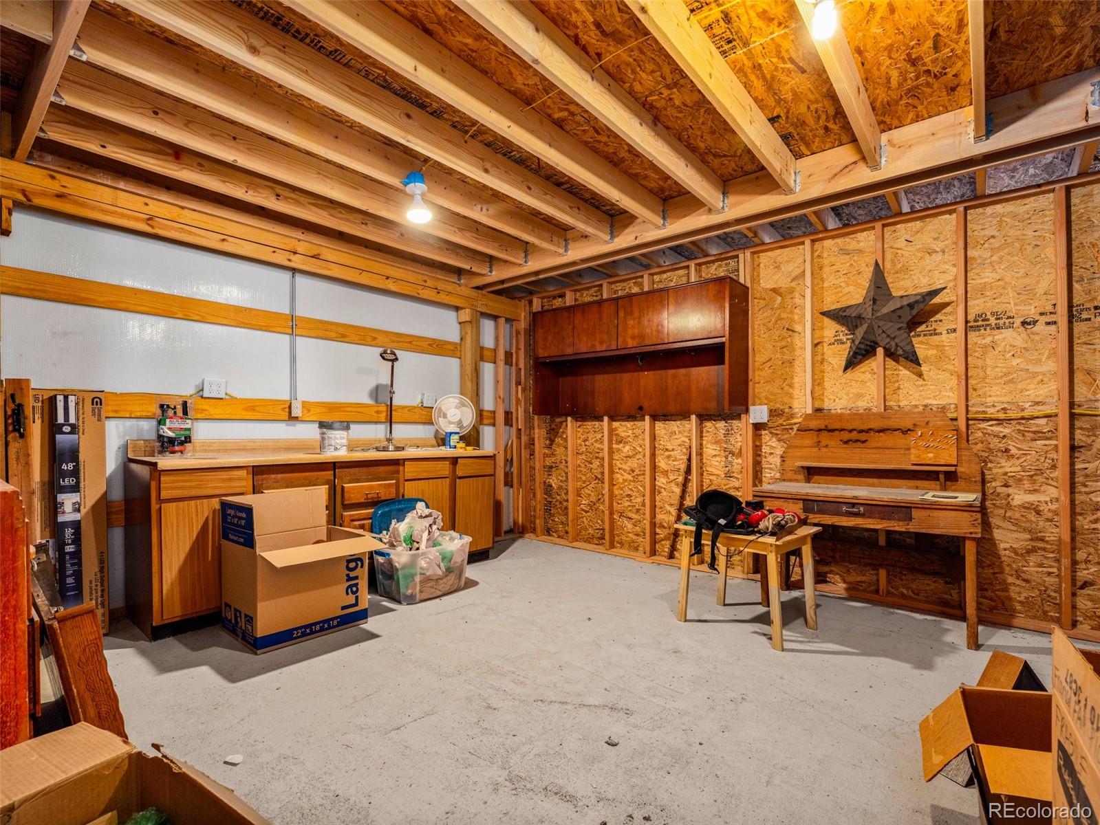 919 South Main Street Fowler, CO 81039 - Photo 27 of 36 a view of gym equipment with racks on the wall