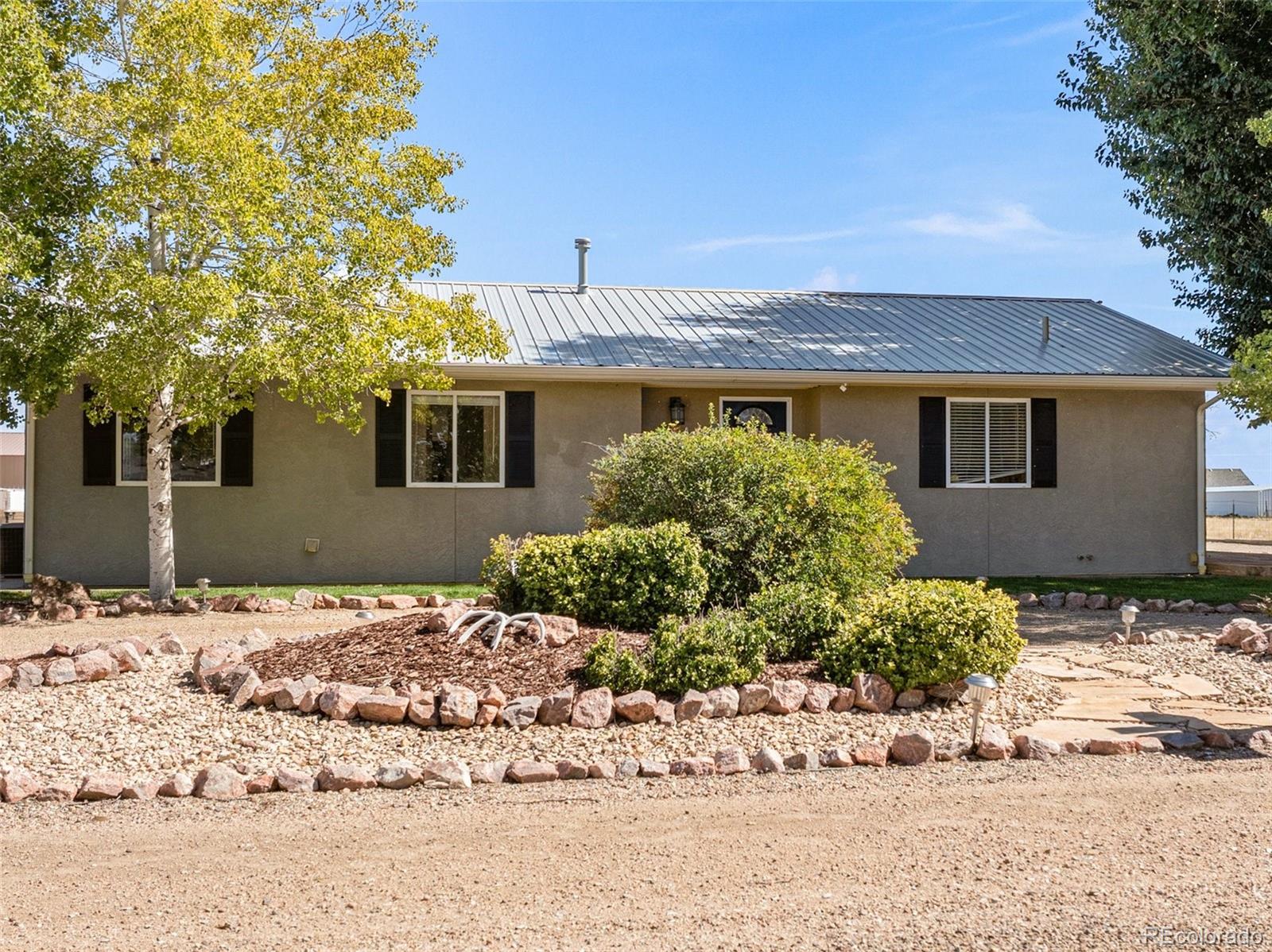 919 South Main Street Fowler, CO 81039 - Photo 29 of 36 a front view of a house with a yard