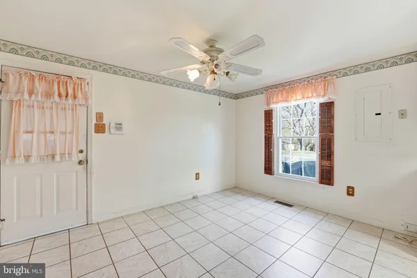 a view of an empty room with a window