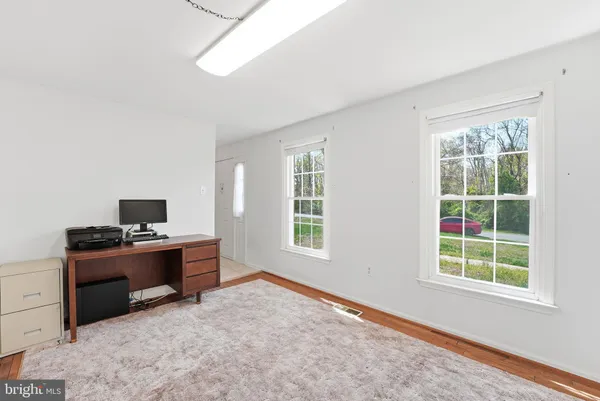 a workspace with furniture and window