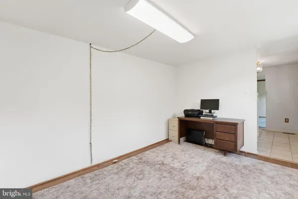 a view of work space with cabinets