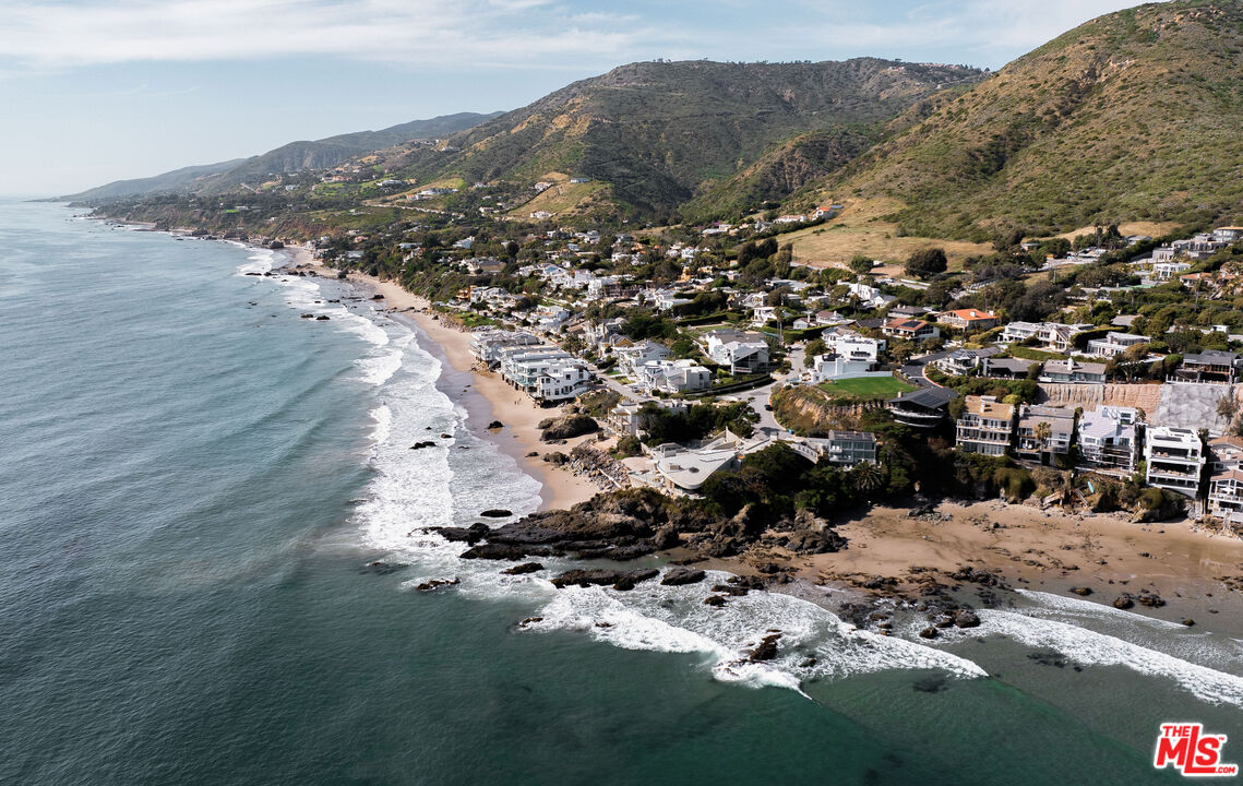 31558 Victoria Point Road Malibu, CA 90265 - Photo 14 of 55 an aerial view of a house with a mountain