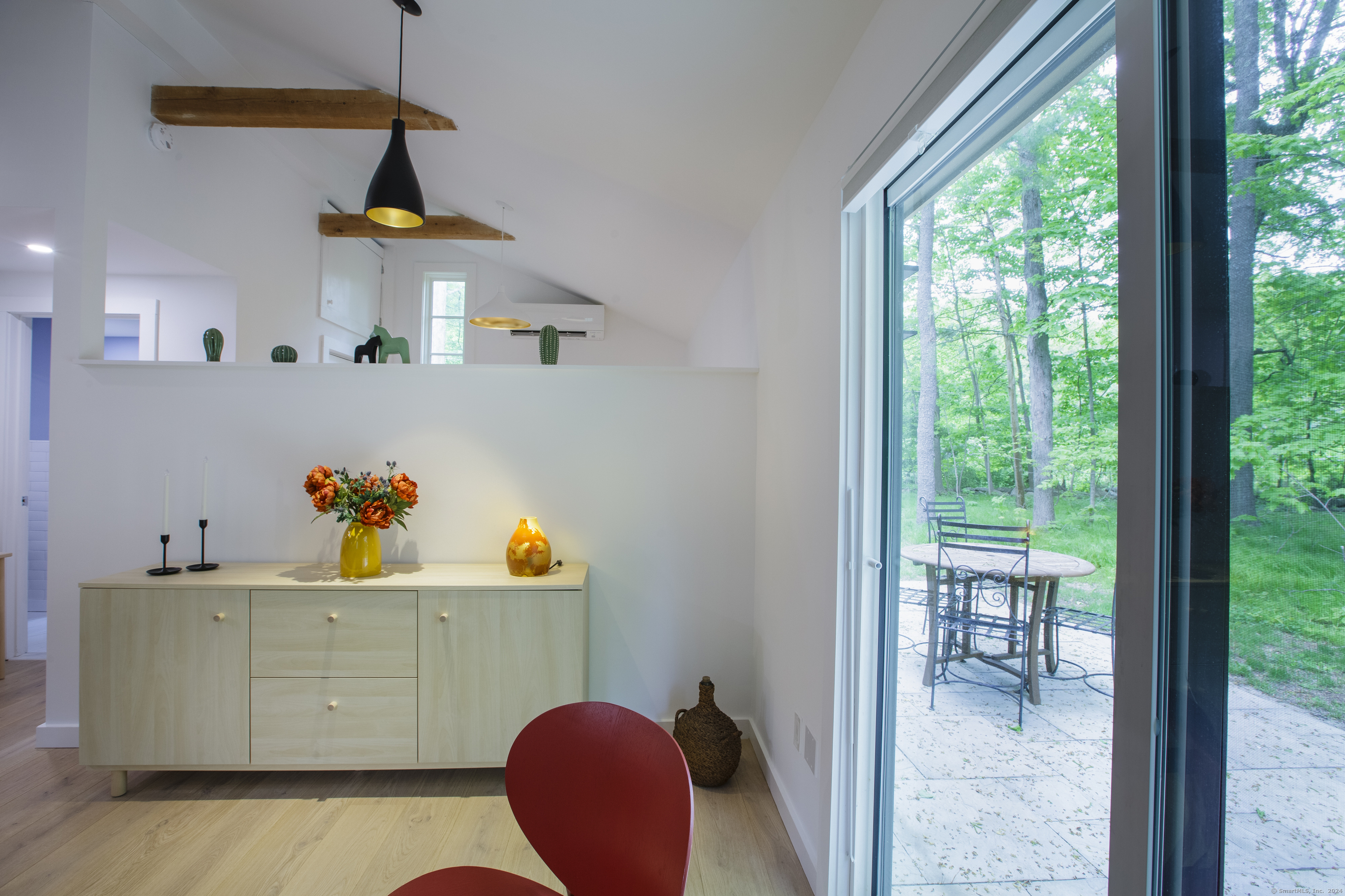 1327 Little Meadow Road Guilford, CT 06437 - Photo 20 of 22 View from sliding glass doors to backyard patio with bistro seating if one chooses to dine al fresco.