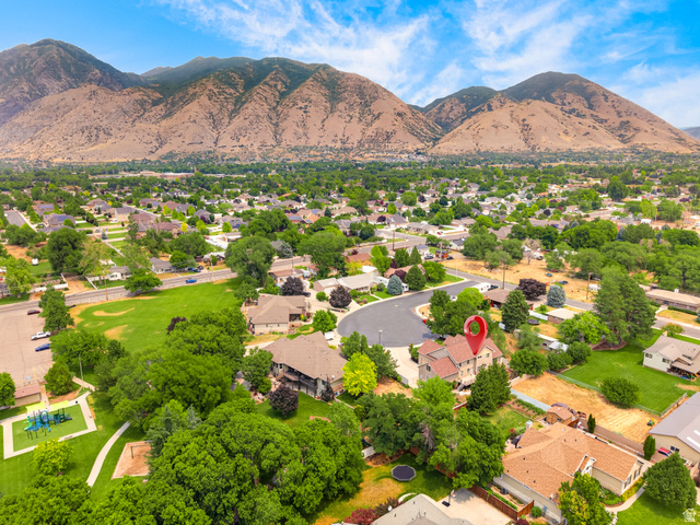 1279 West 1500th Street North Mapleton, UT 84664 - Photo 80 of 83 Aerial perspective showcasing a residential area with mountains in the background