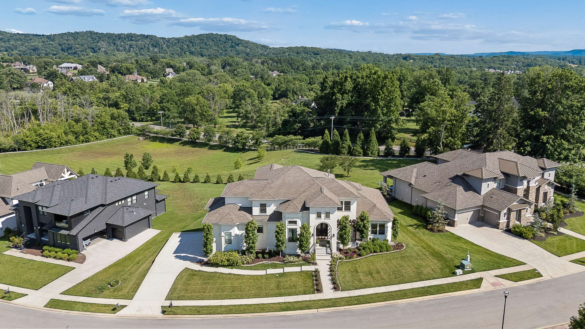 6004 Lookaway Circle Franklin, TN 37067 - Photo 3 of 71 an aerial view of multiple houses with a swimming pool