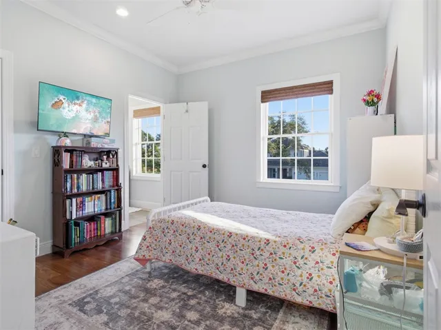 a bedroom with furniture and a window