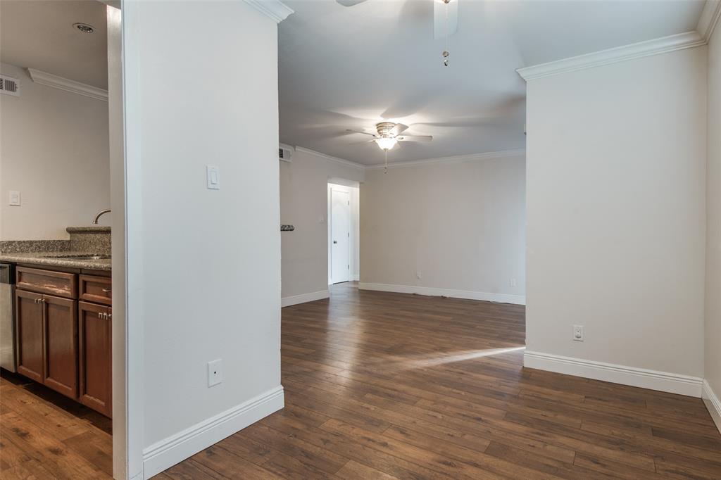 3907 Gilbert Avenue, Unit 5 Dallas, TX 75219 - Photo 6 of 11 wooden floor in an empty room with a window