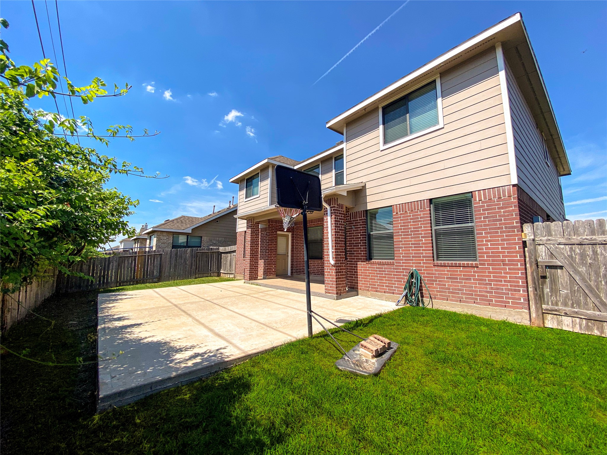 6227 Carnaby Lane Rosenberg, TX 77471 - Photo 29 of 30 Covered patio in rear of house and your own private basket court! House is available immediately. Call today!