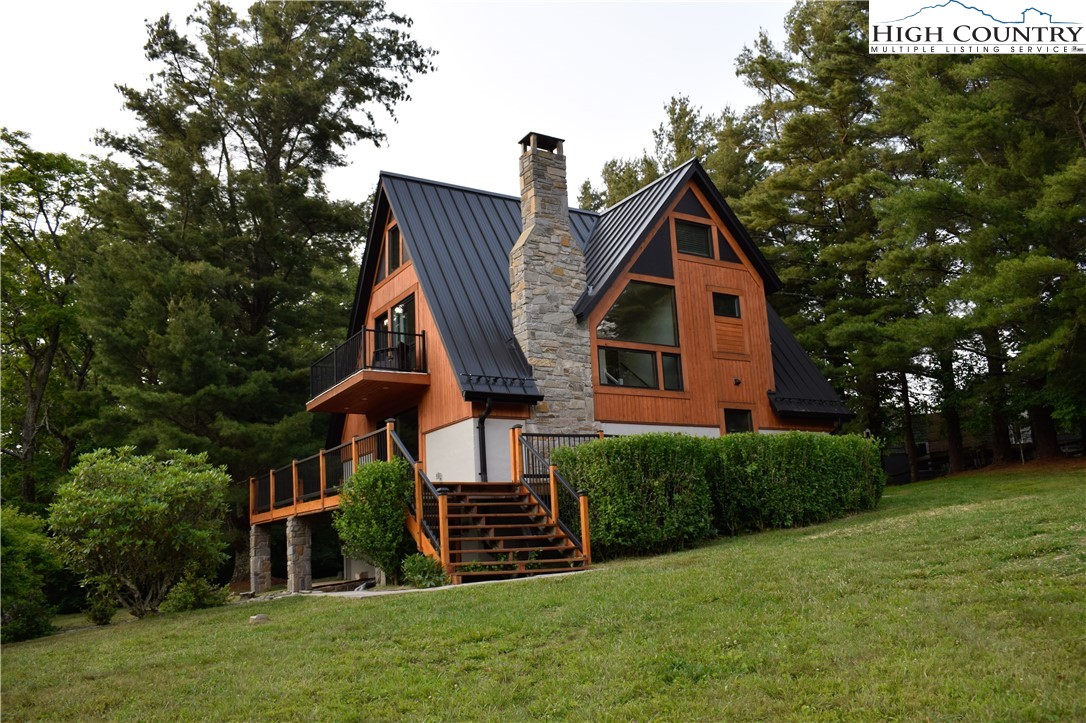 146 Trillium Ridge Boone, NC 28607 - Photo 1 of 41 a front view of a house with a yard