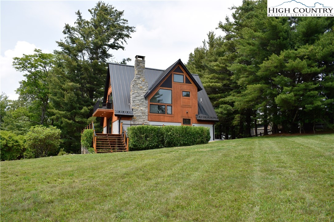 146 Trillium Ridge Boone, NC 28607 - Photo 11 of 41 a front view of a house with a yard