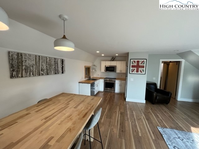 146 Trillium Ridge Boone, NC 28607 - Photo 15 of 41 a kitchen with stainless steel appliances granite countertop a refrigerator a stove and a wooden floors