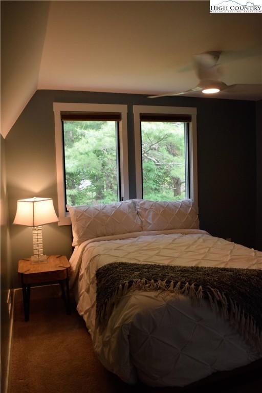 146 Trillium Ridge Boone, NC 28607 - Photo 31 of 41 a bedroom with a bed lamp and window