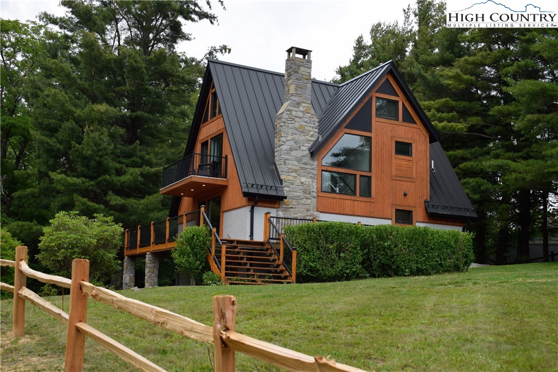 146 Trillium Ridge Boone, NC 28607 - Photo 6 of 41 a view of a house with backyard and trees