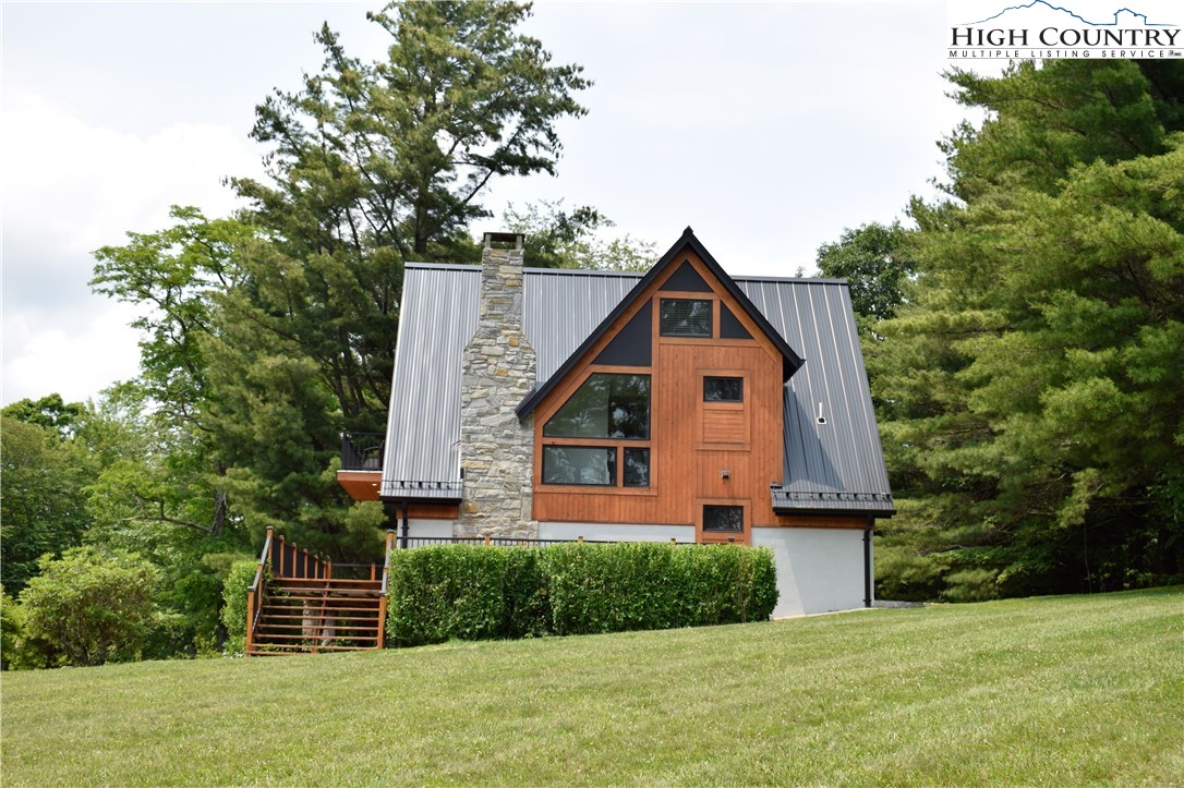 146 Trillium Ridge Boone, NC 28607 - Photo 7 of 41 a front view of a house with a yard