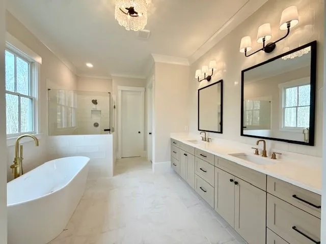 a spacious bathroom with a double vanity sink a large mirror and shower