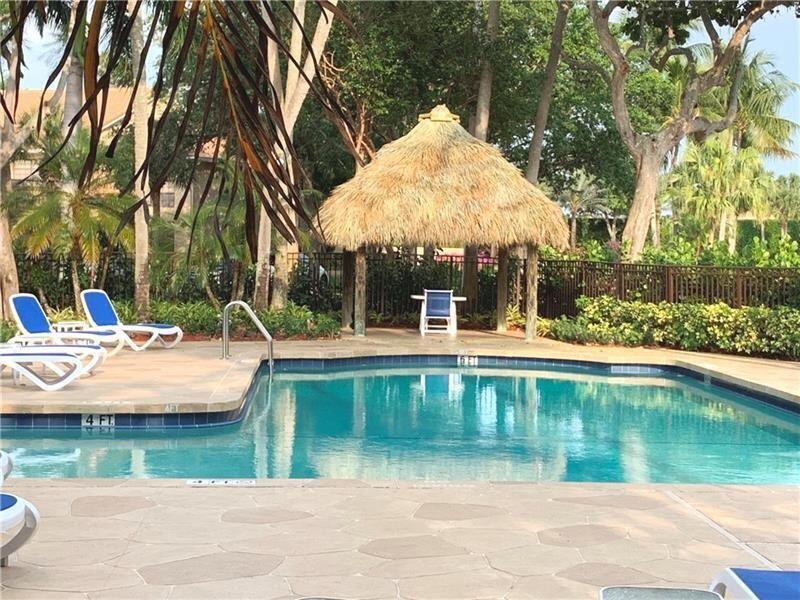 6674 Montego Bay Boulevard, Unit E Boca Raton, FL 33433 - Photo 17 of 18 a view of swimming pool with a patio