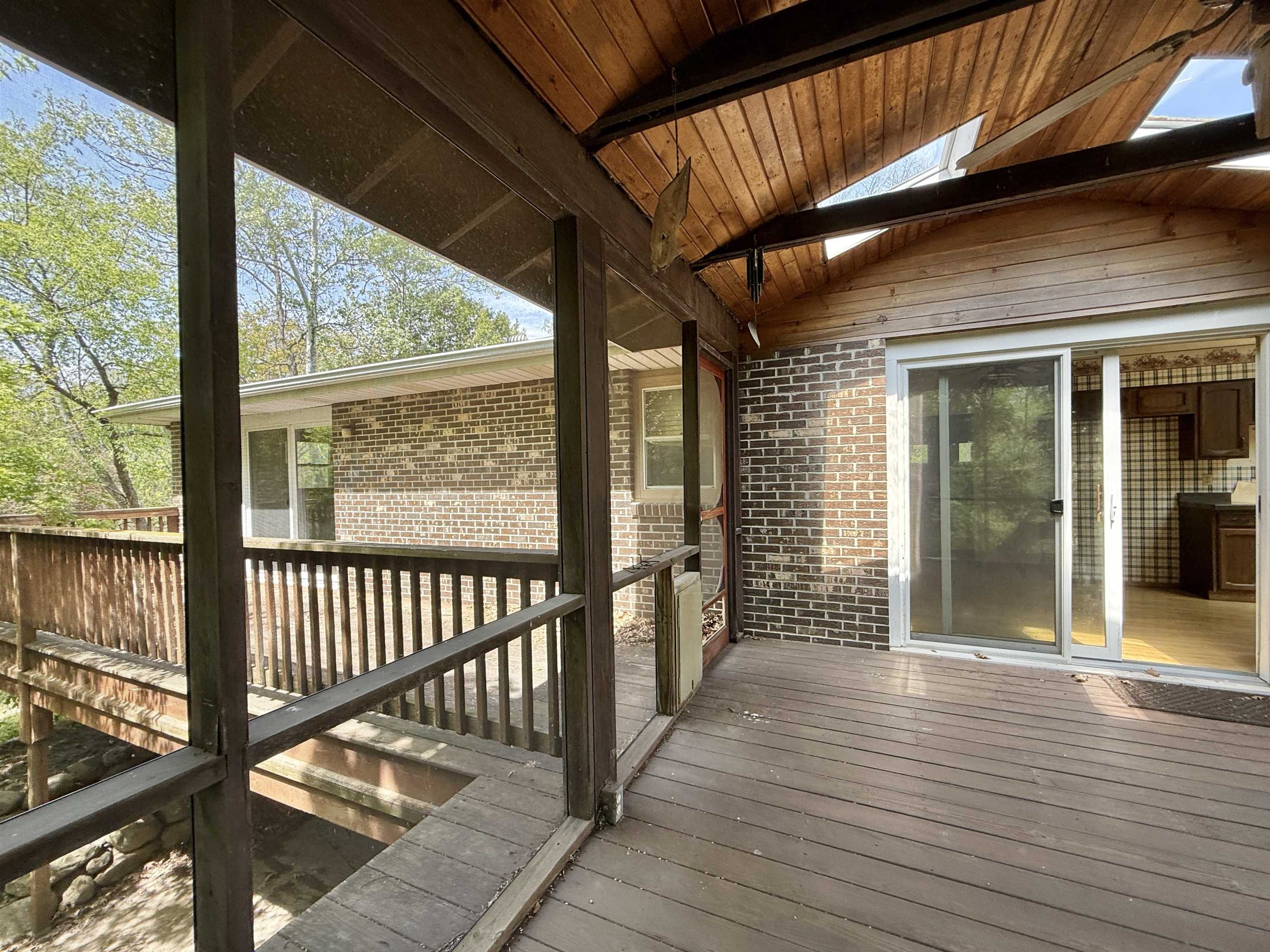 3620 Valerie Road Roscoe, IL 61073 - Photo 19 of 26 a view of a porch with wooden floor