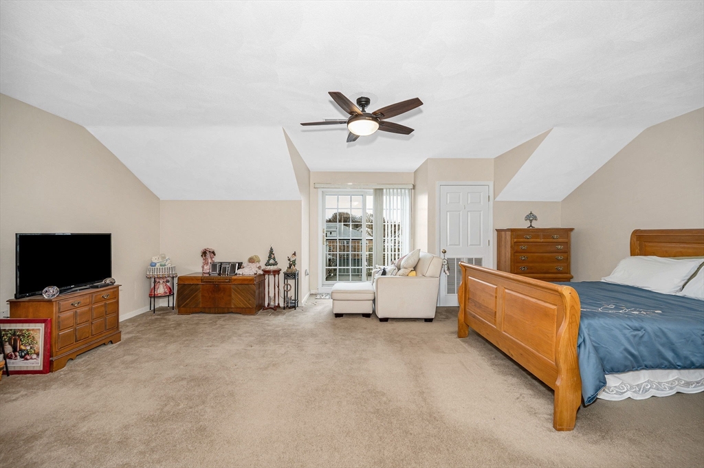 39 Broadway, Unit 305 Malden, MA 02148 - Photo 19 of 36 a living room with furniture and a flat screen tv