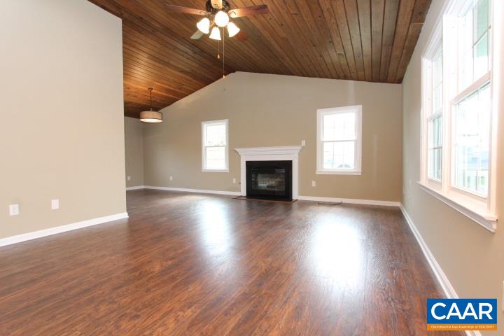 60 Geranium Road Ruckersville, VA 22968 - Photo 3 of 21 an empty room with wooden floor chandelier and windows