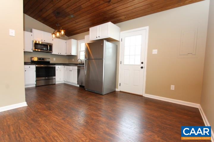 60 Geranium Road Ruckersville, VA 22968 - Photo 6 of 21 a kitchen with stainless steel appliances a refrigerator and wooden floor